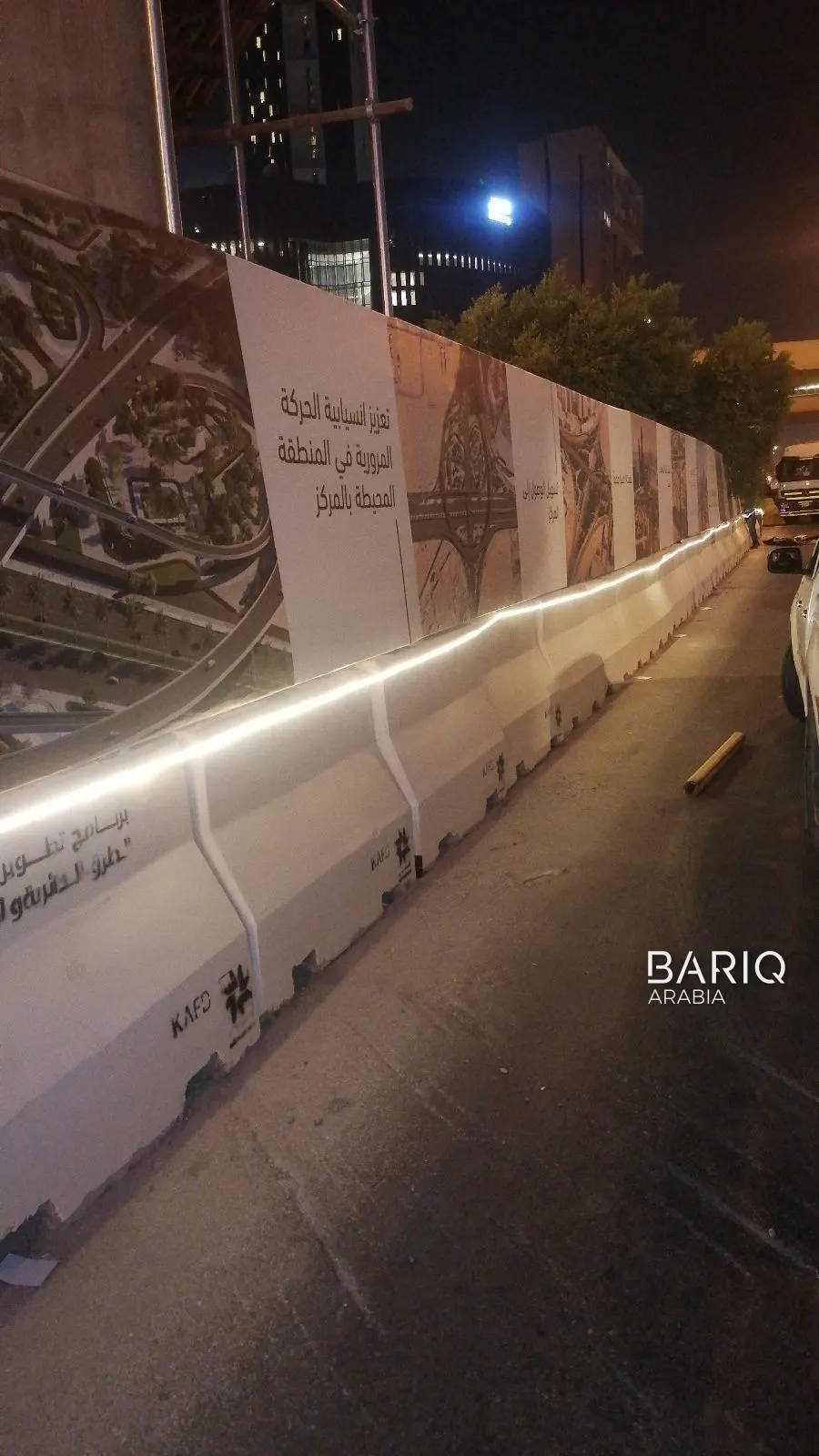 KAFD road works site fence beside the road at night