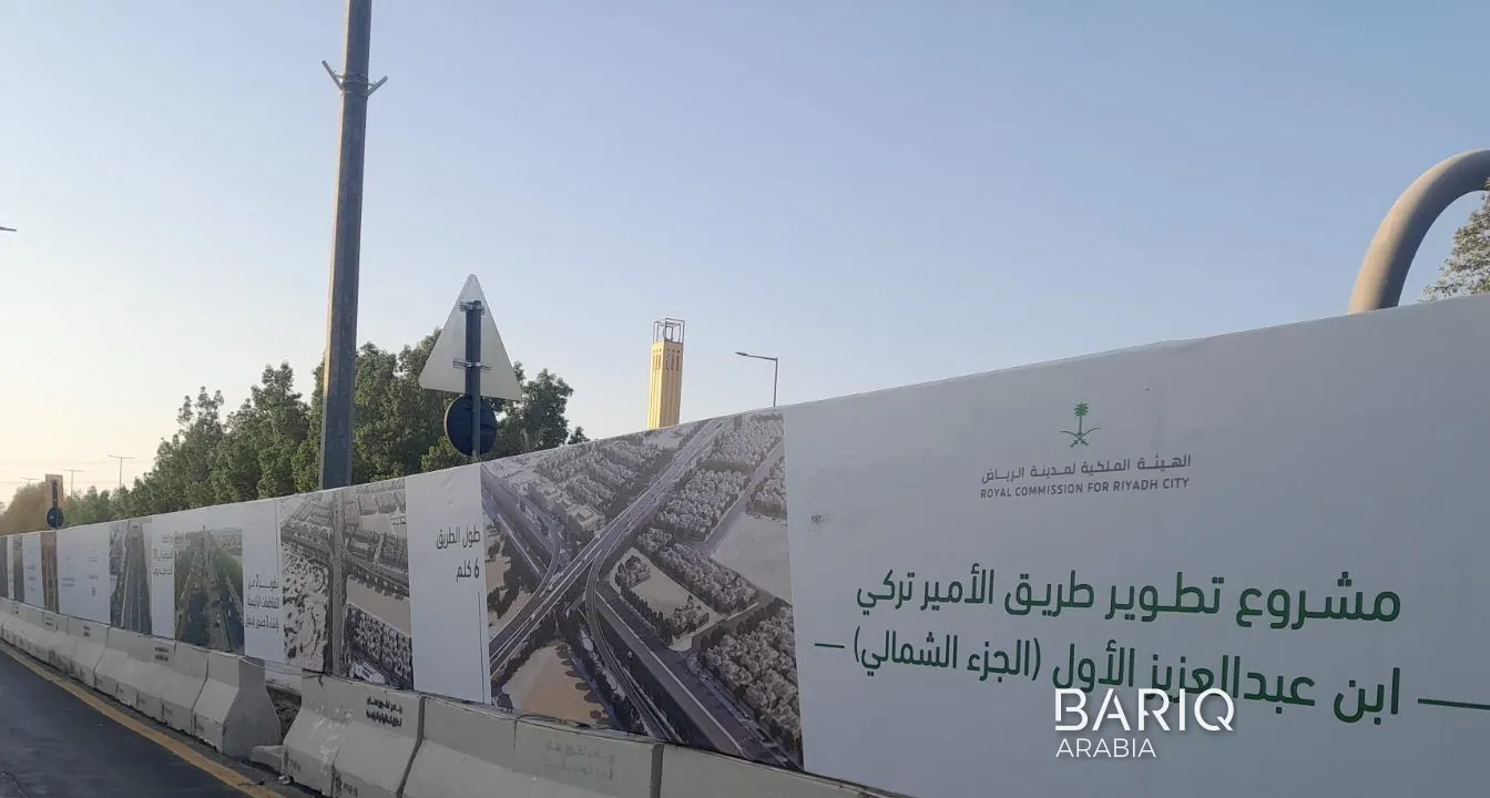 Hoarding panels fixed to concrete barriers on a Prince Turki Road diversion