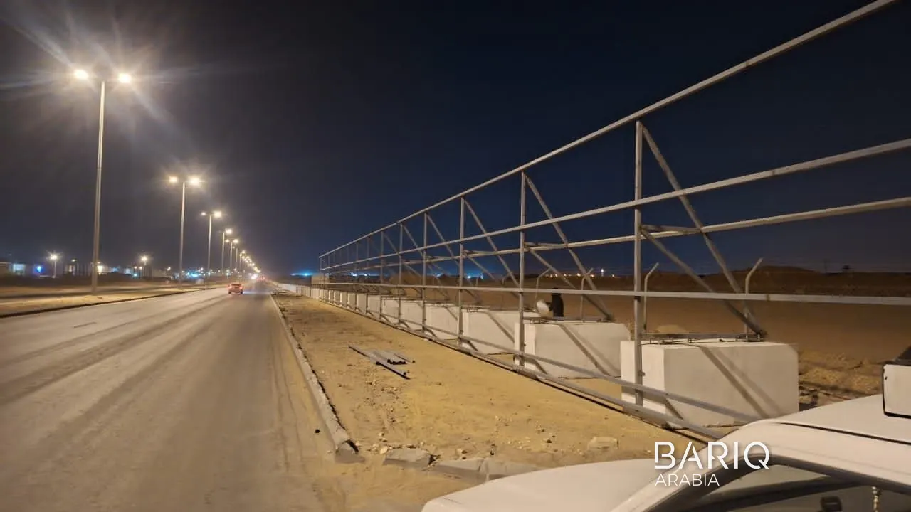 Steel fence supports along the road on the Al-Rusan project