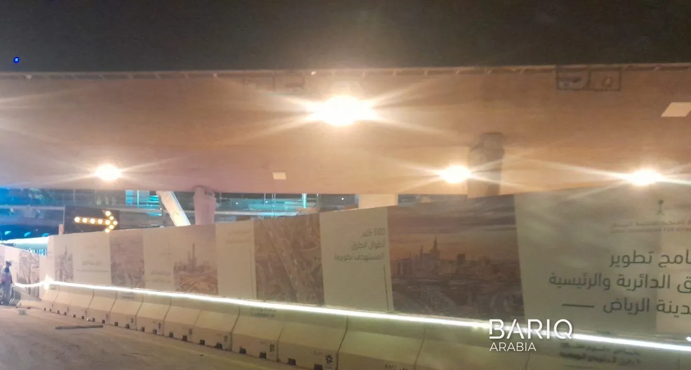 KAFD road works hoarding under the bridge at night