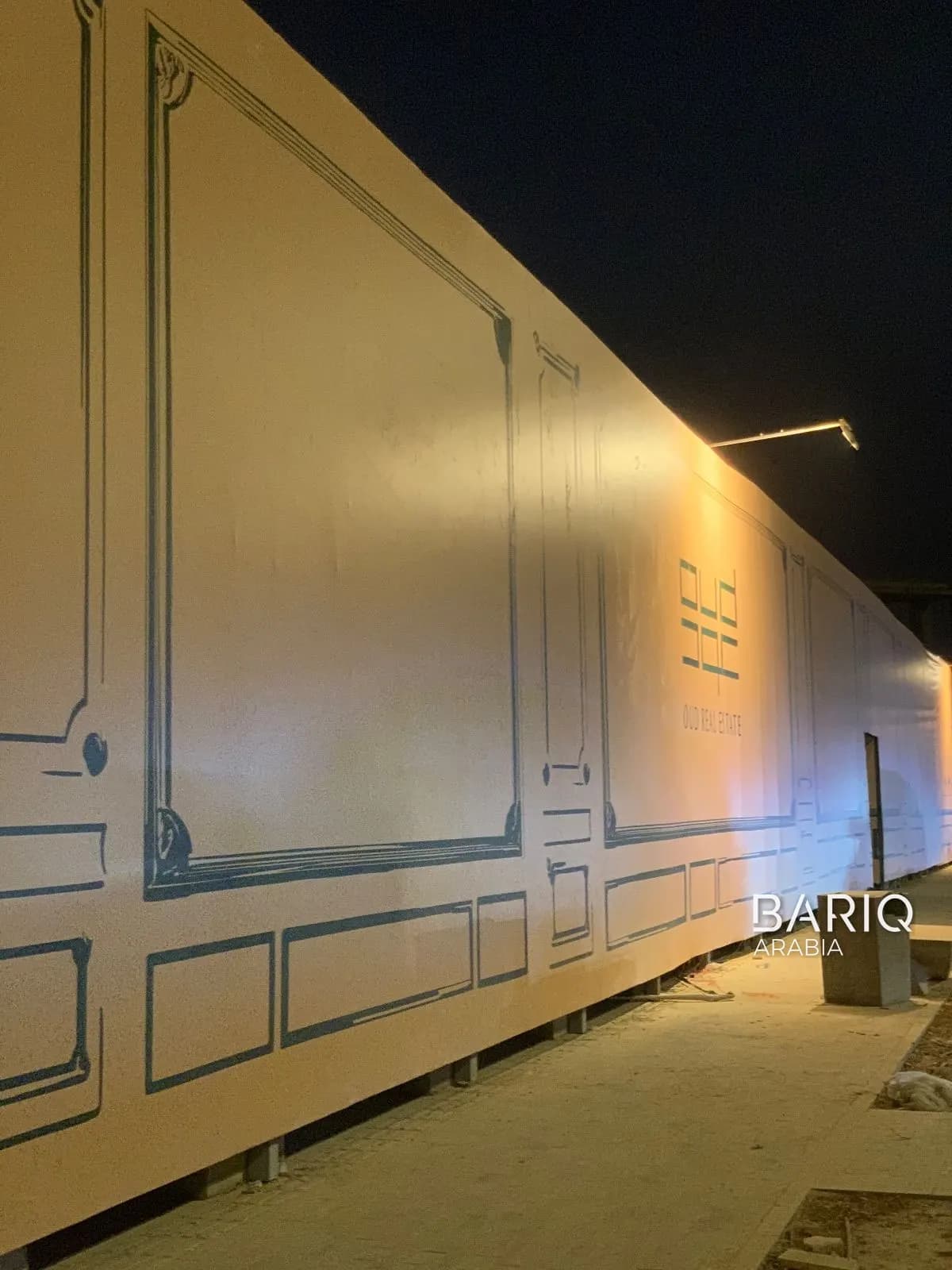 Oud Reserve framed-panel hoarding at night